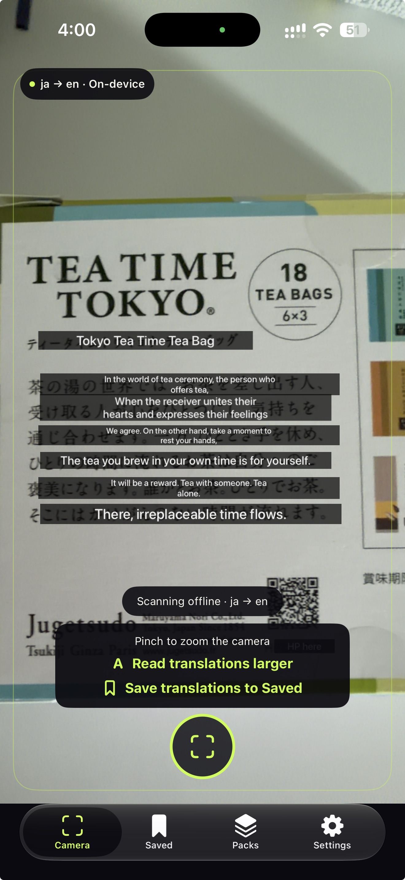 Ghost Translate camera view placing English translations over Japanese text on a tea box